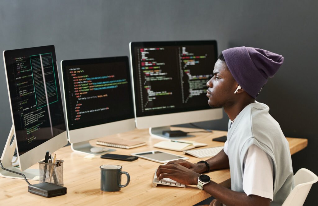 Responsive website design mockup with code and analytics