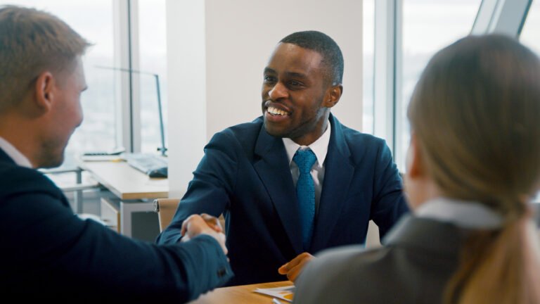 Handshake representing partnership for SEO services in Nigeria