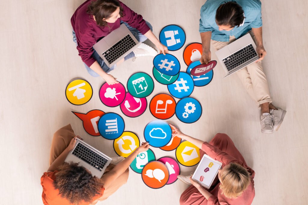 Icons of Facebook, Instagram, LinkedIn, TikTok, Twitter, and YouTube on mobile device